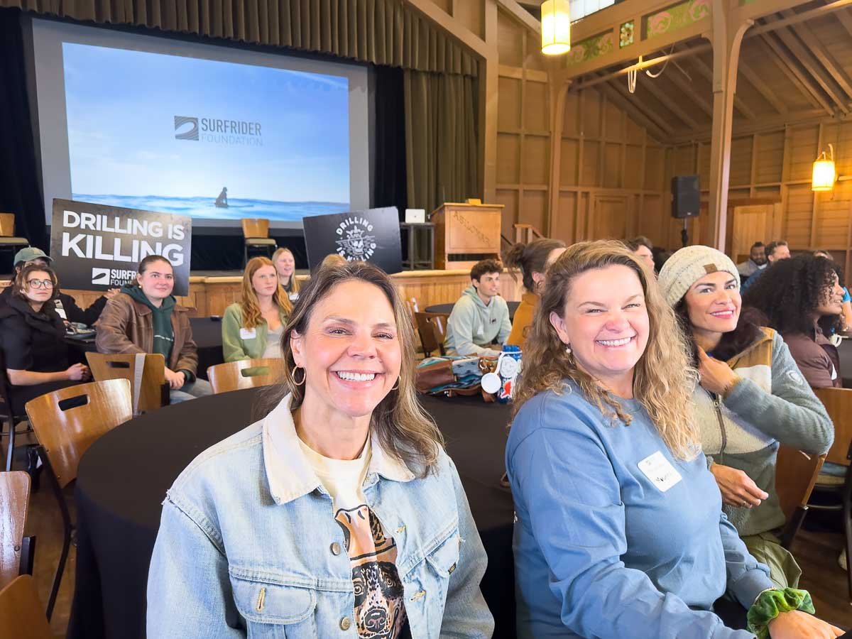 Surfrider Monterey volunteers, Gen Millington  - Plastics Lead and Christen Jones - Event Coordinator smile for the camera during the Surfrider Regional Conference. Photo: Harry Parker Photography