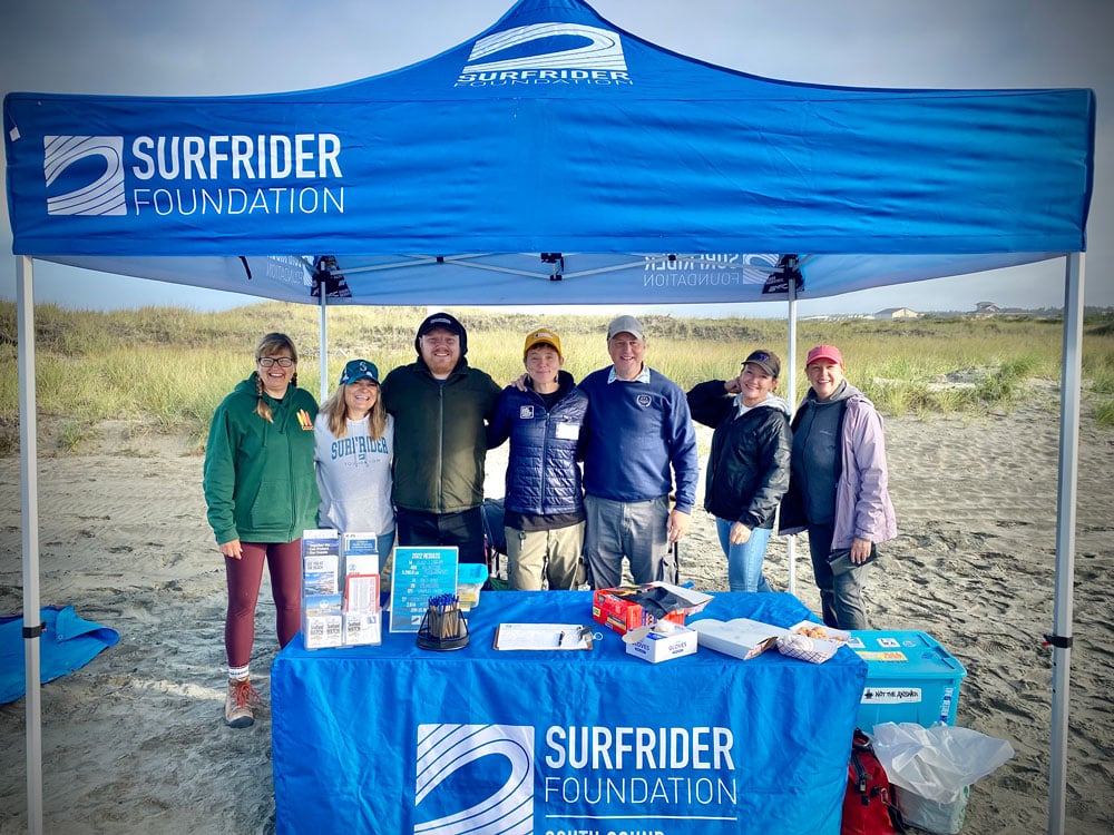 Kelly Jones With the Surfrider South Sound Chapter at a event on the beach.