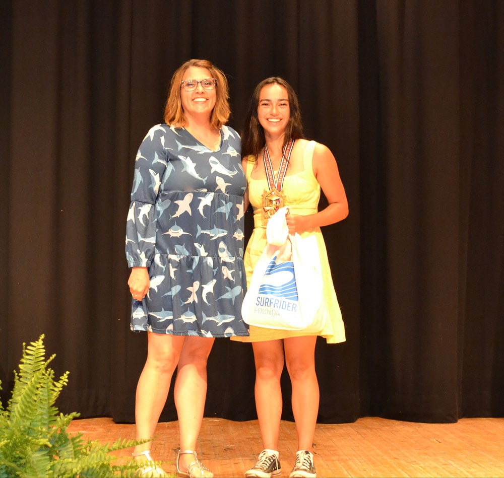 Stephen Decatur High School Surfrider Club student receiving an award