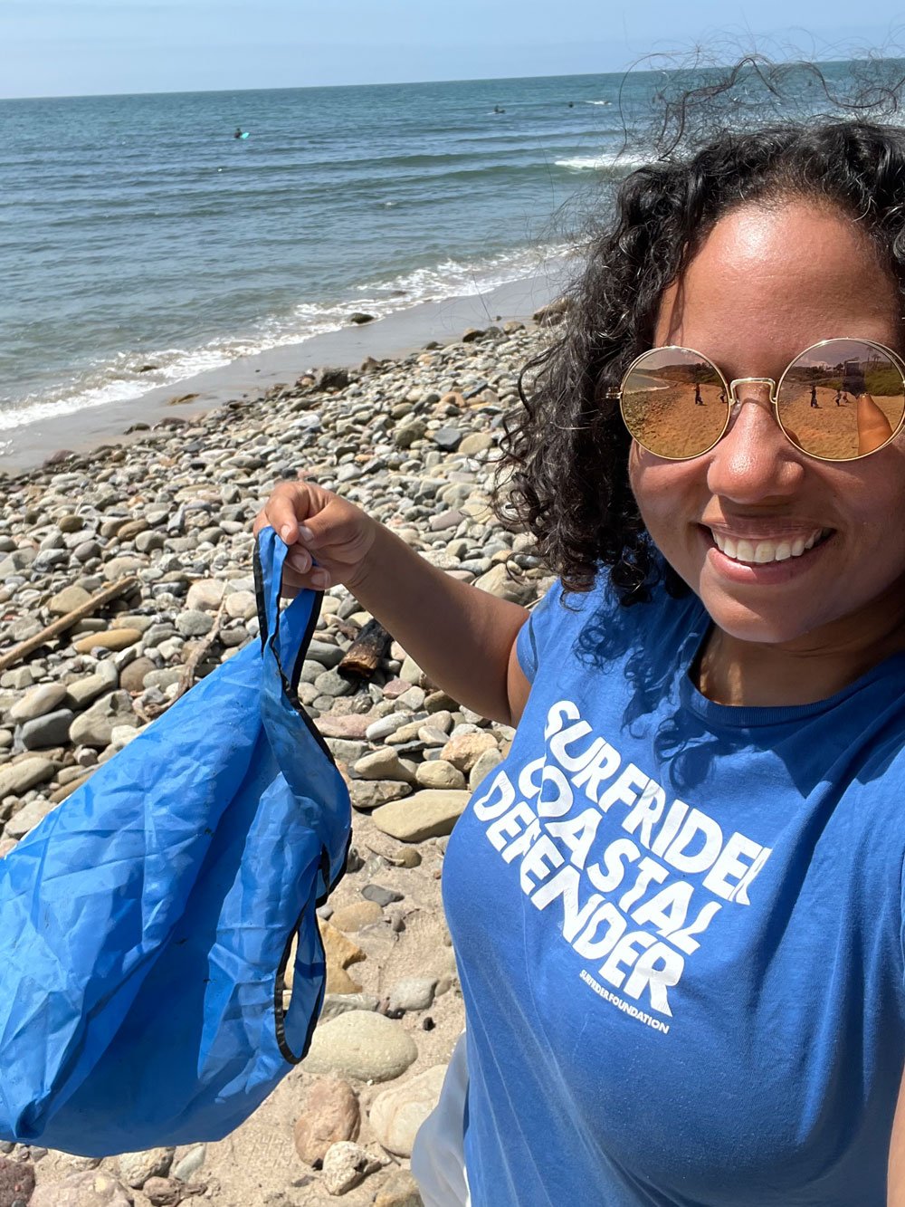 Andrika Payne with the Los Angeles Chapter picking up trash at the beach