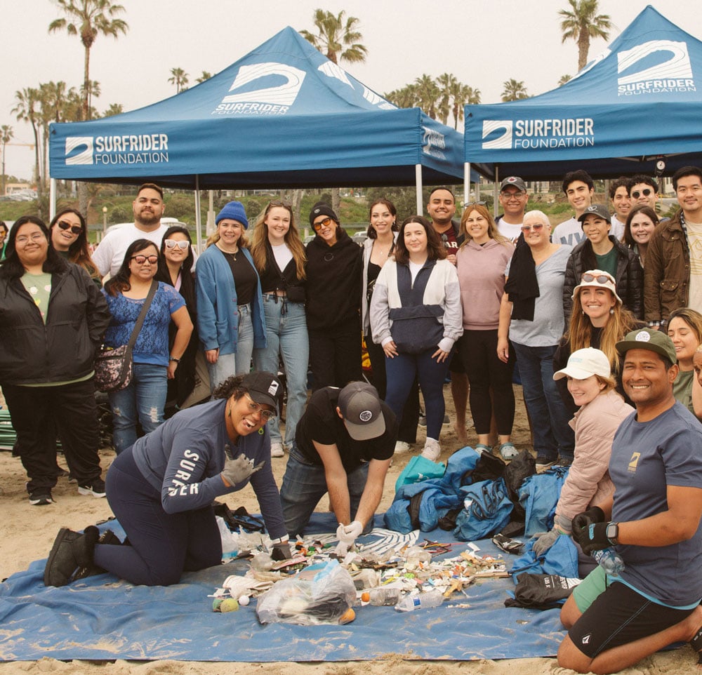 Andrika Payne with the Los Angeles Chapter sorting trash at a beach cleanup