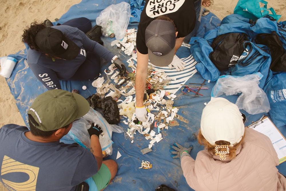 Andrika Payne with the Los Angeles Chapter sorting trash at a beach cleanup