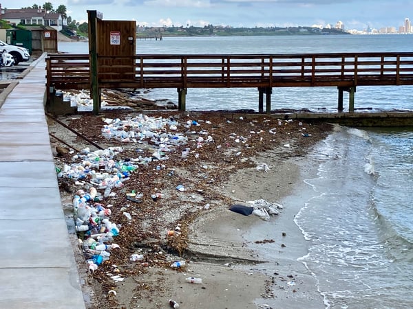 Plastic trash washed up on the shore of Corpus Christi Bay