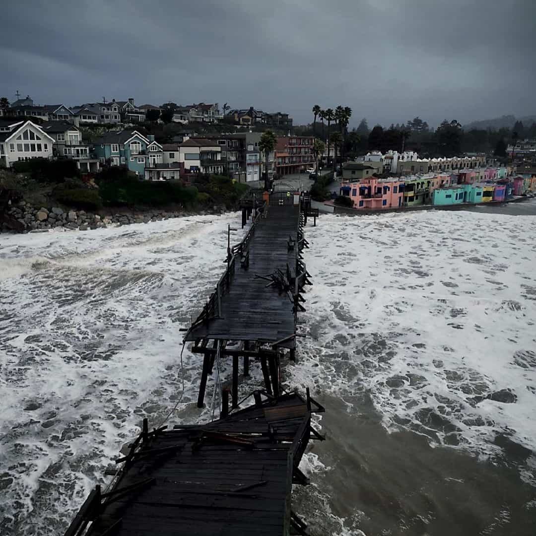 Storm tides cause a section of the Santa Cruz Boardwalk to collapse.