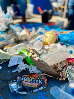 A closeup image of a pile of trash waiting to be sorted