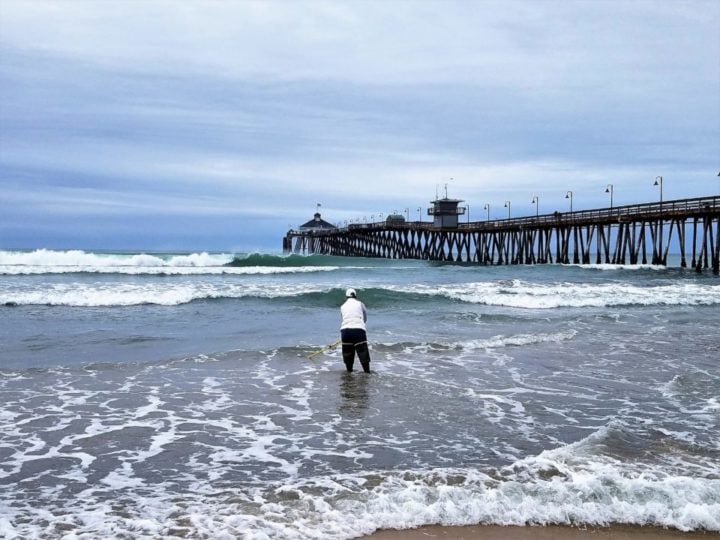 county employee testing water at Imperial Beach pier