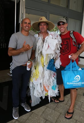 Surfrider Foundation Volunteers Cnavass The Beach In Miami During Swim Week To Remind People Not To Leave Any Trash Behind, And To Trade Out Plastic Bags For Reusable Shopping Bags. Surfer Kelly Slater Was Happy To Support The Cause And Pose With The Bag