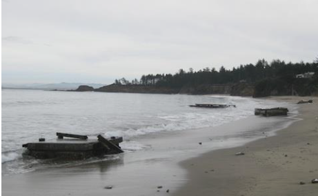 Abandon docks from Coos Bay that washed ashore Lighthouse Beach