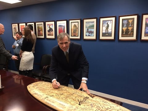Senator Jeff Merkley signs on to surfboard opposing Atlantic drilling