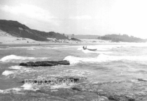 A Pacific City doryman arrives a lone beach circa early 1900s