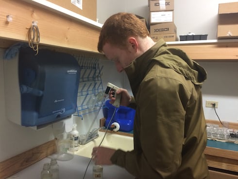 Leland Wood works back in the lab to process water quality samples
