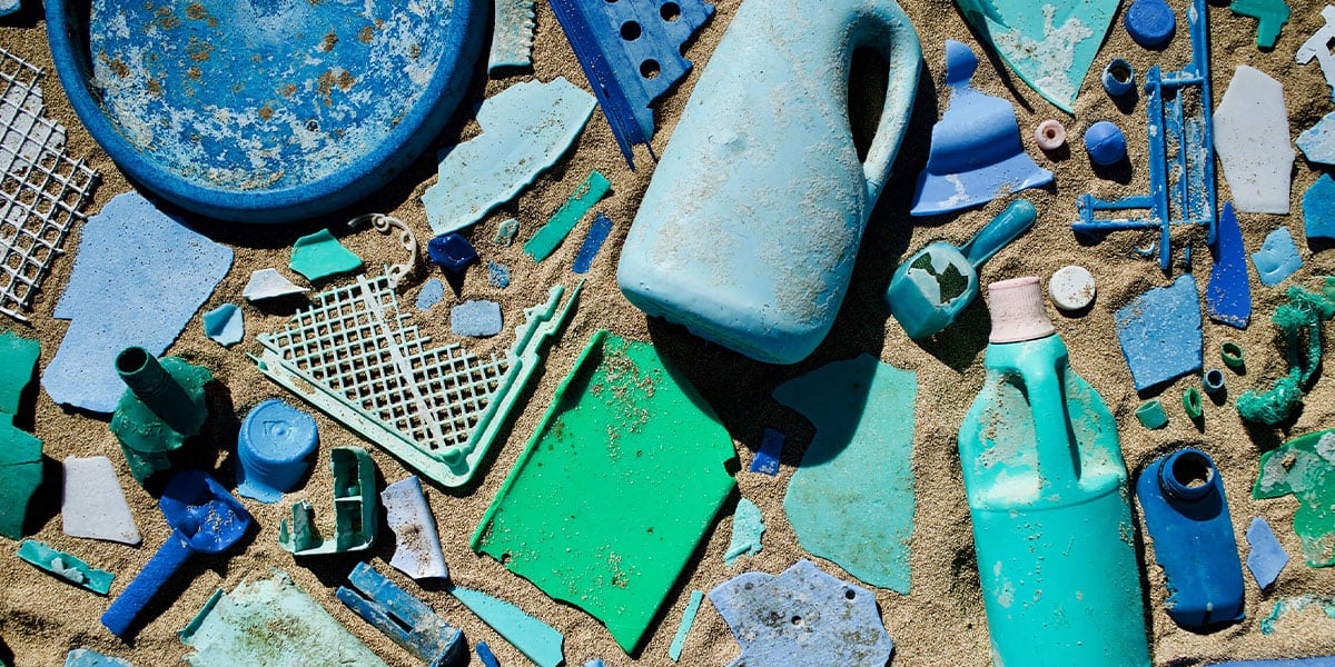 Blue-and-green-plastic-garbage-on-a-beach