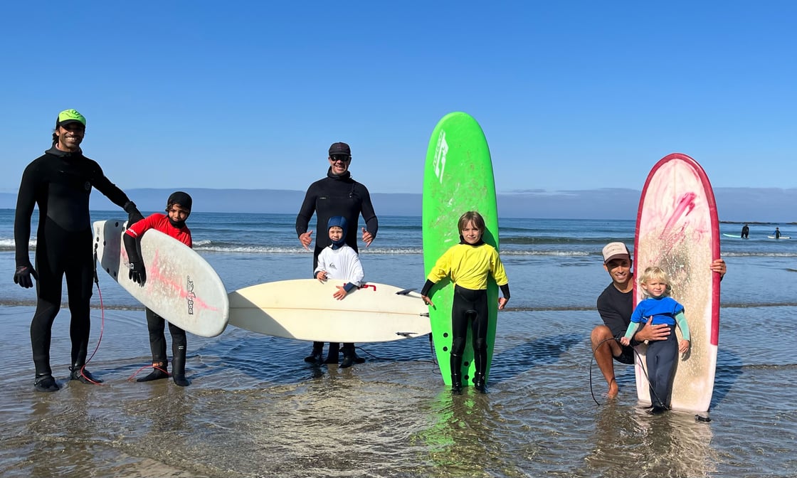 kids holding surfboards at Otter Rock and Roll