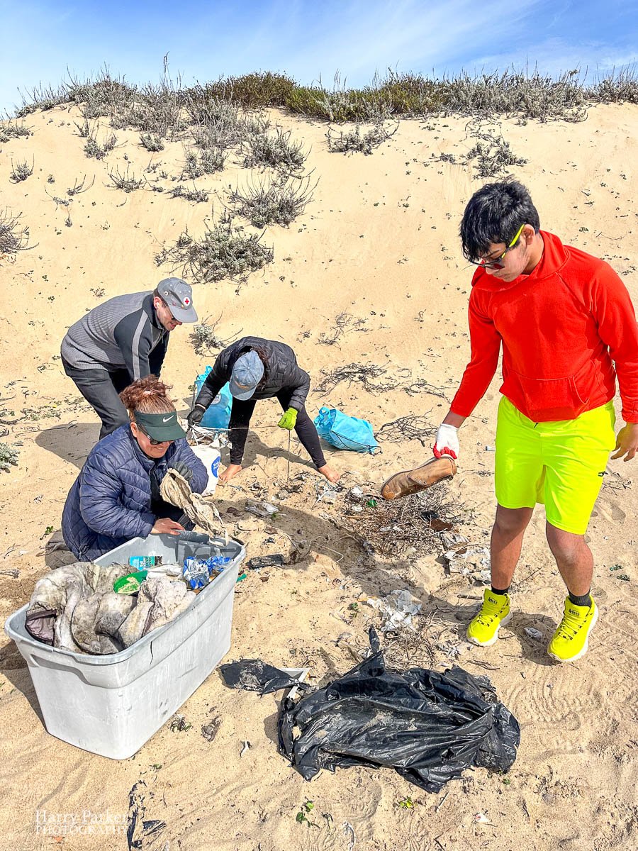 Surfrider volunteers pick up garbage off Del Monte Beach, Monterey, CA