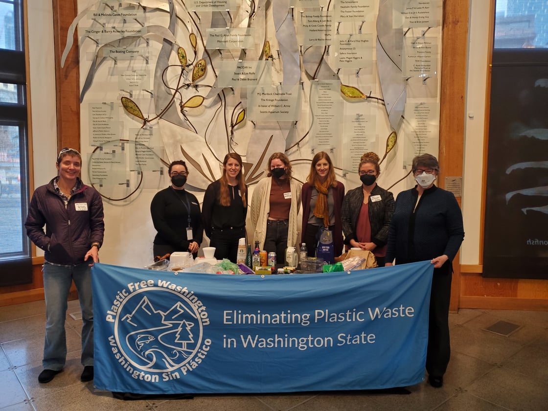 Members of the Plastic Free Washington Coalition pose for a picture during a plastics bill release event  