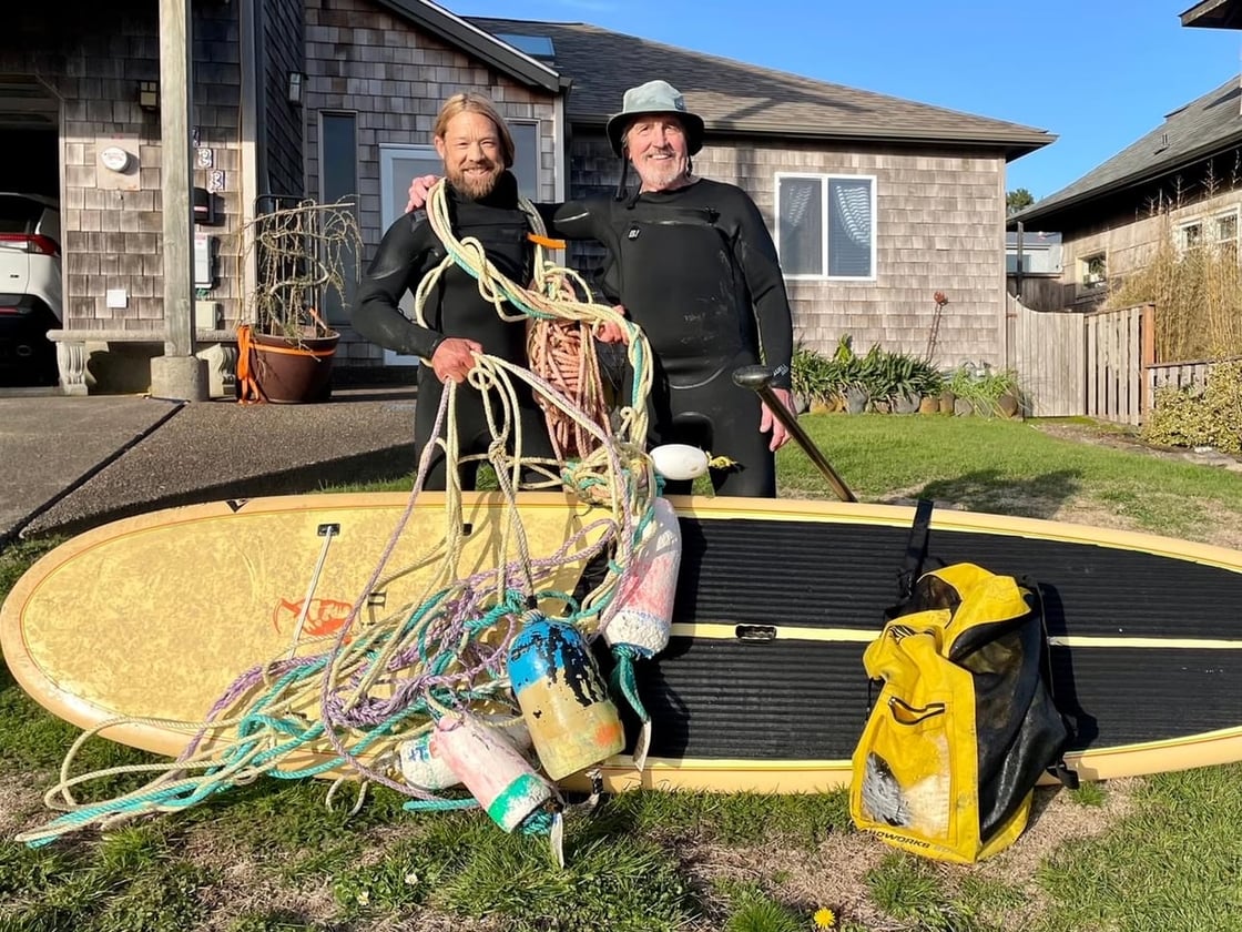 Surfrider volunteers and staff with marine debris from recent cleanup