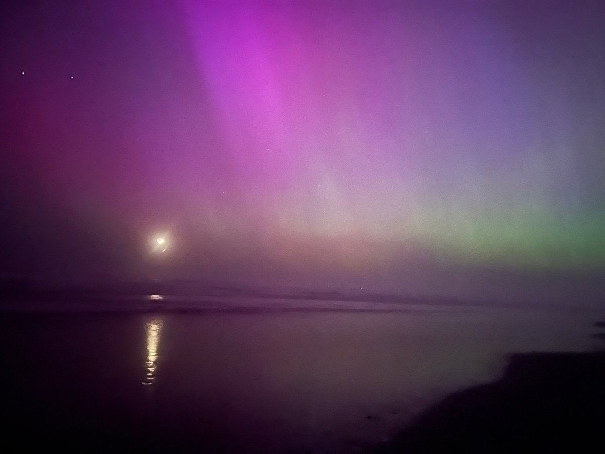 A hazy moon with Northern Lights over South Beach. Photo Charlie Plybon