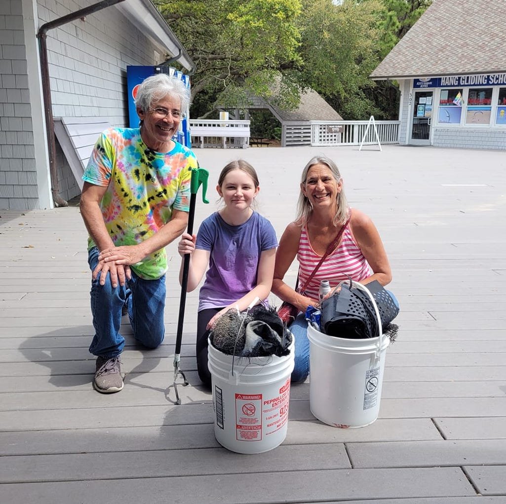 a family at a beach cleanup