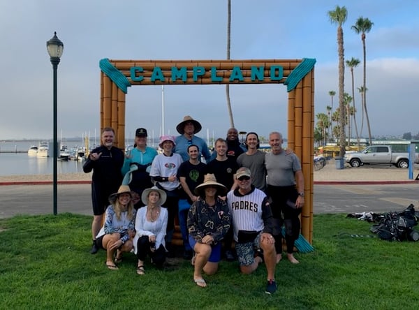 The Scuba and support crew posing in front of a Campland sign on Mission Bay
