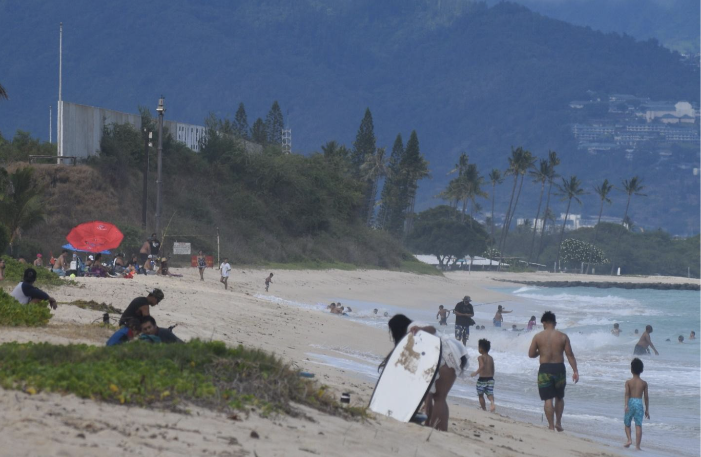 Families playing at Puʻuloa beach