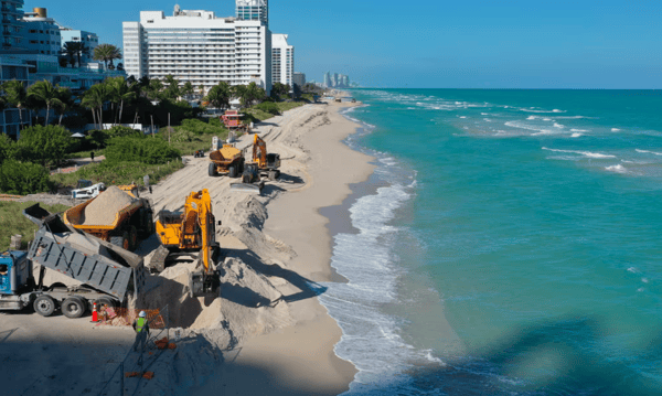 Image of Florida's eroding beaches with tractors