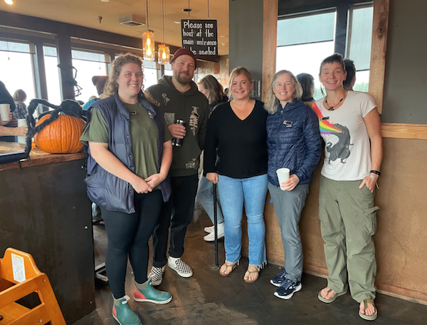 Owner of Adrift, Tiffany Turner, poses with Surfrider staff and volunteers