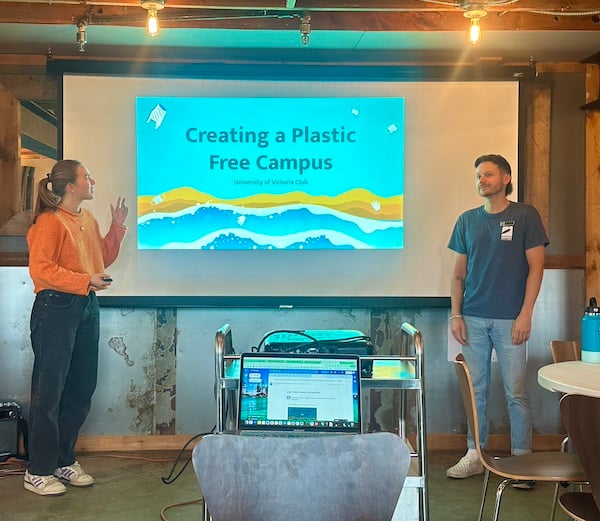 UVic students presenting an intro powerpoint slide on their plastic free campus 