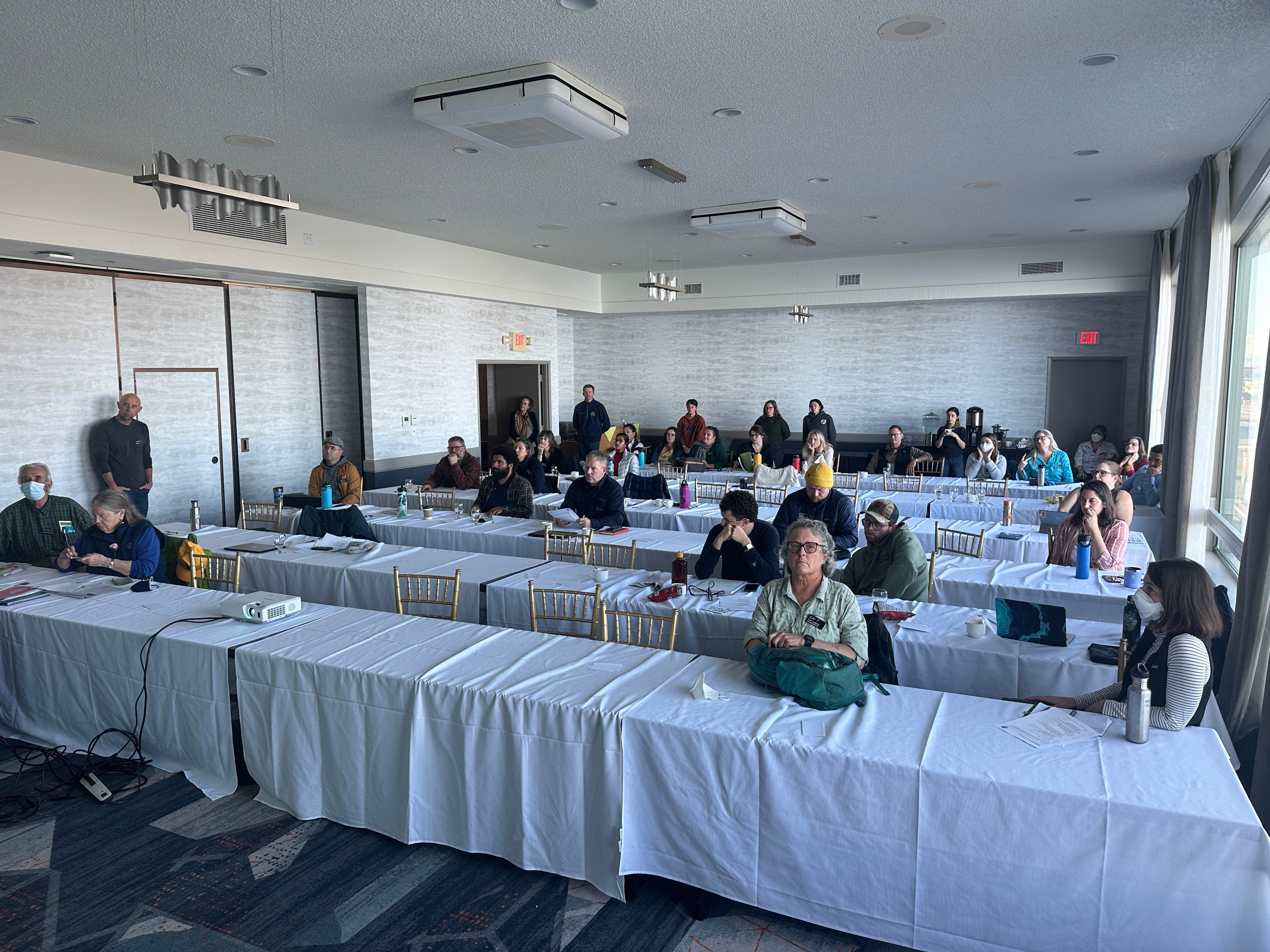 A conference room full of attendees at the Marine Debris Action Plan Workshop