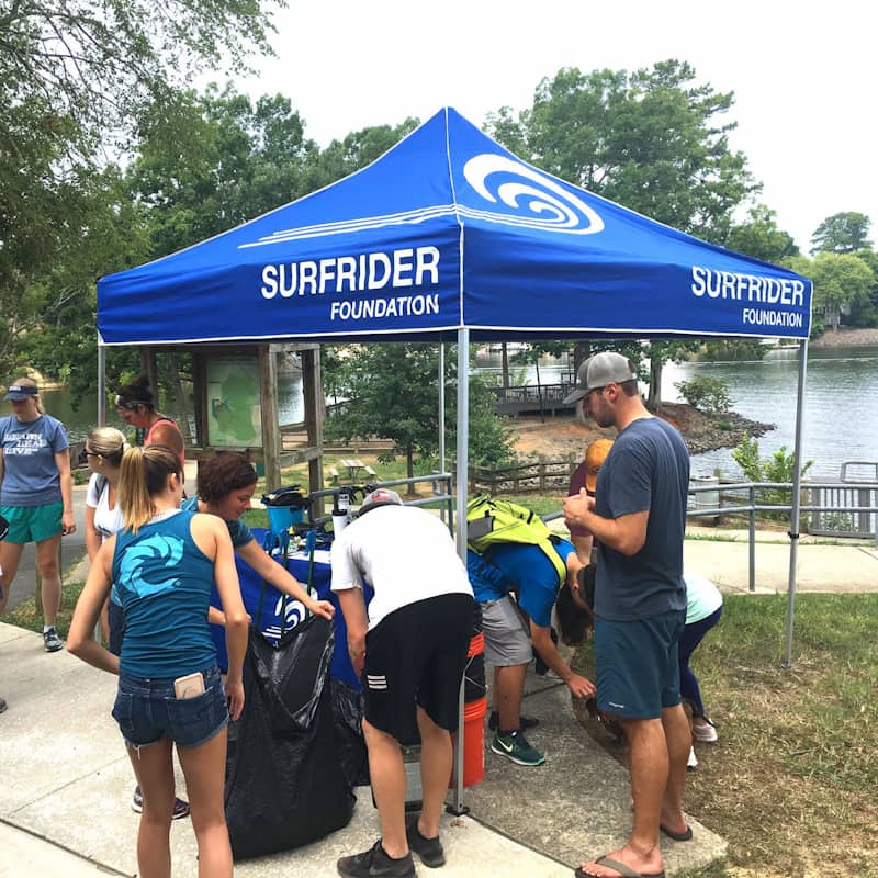 The Surfrider Charlotte team looks over the results of their lake cleanup event.