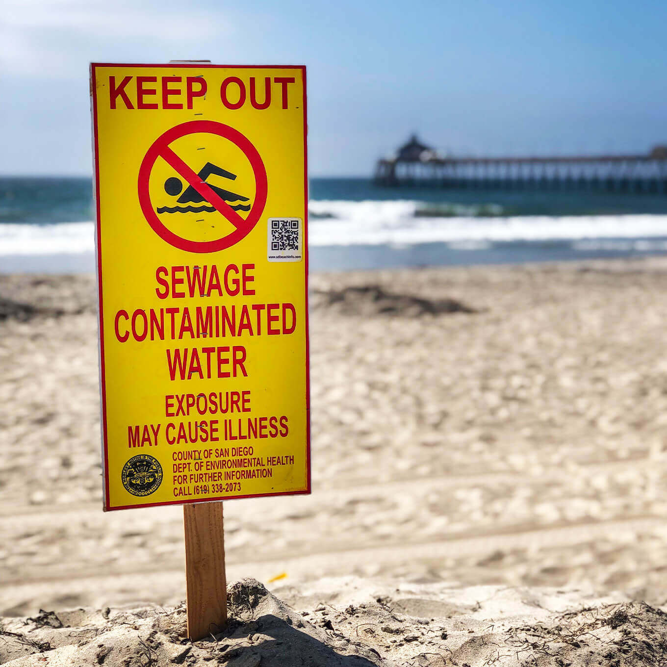 sewage contaminated water sign at the beach