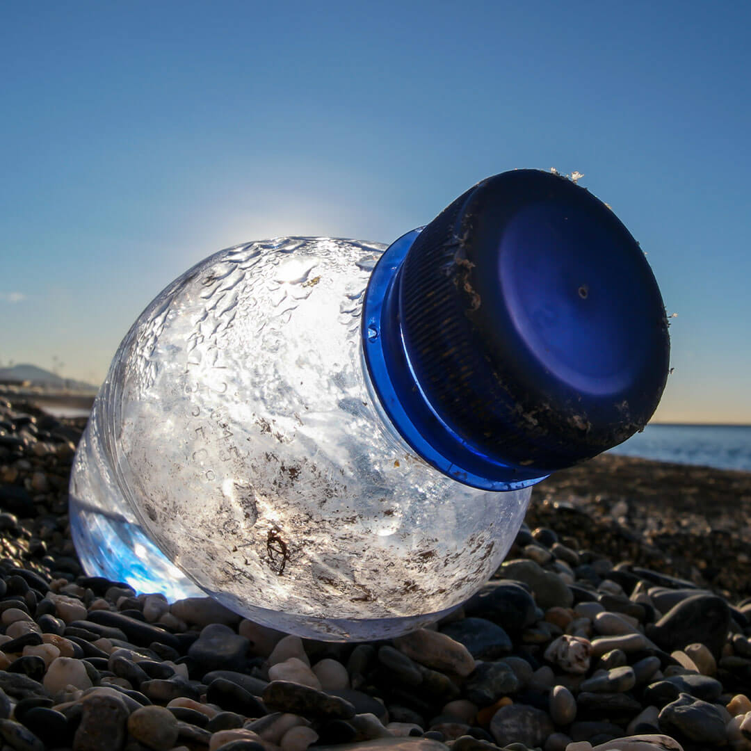 plastic bottle litter on the beach