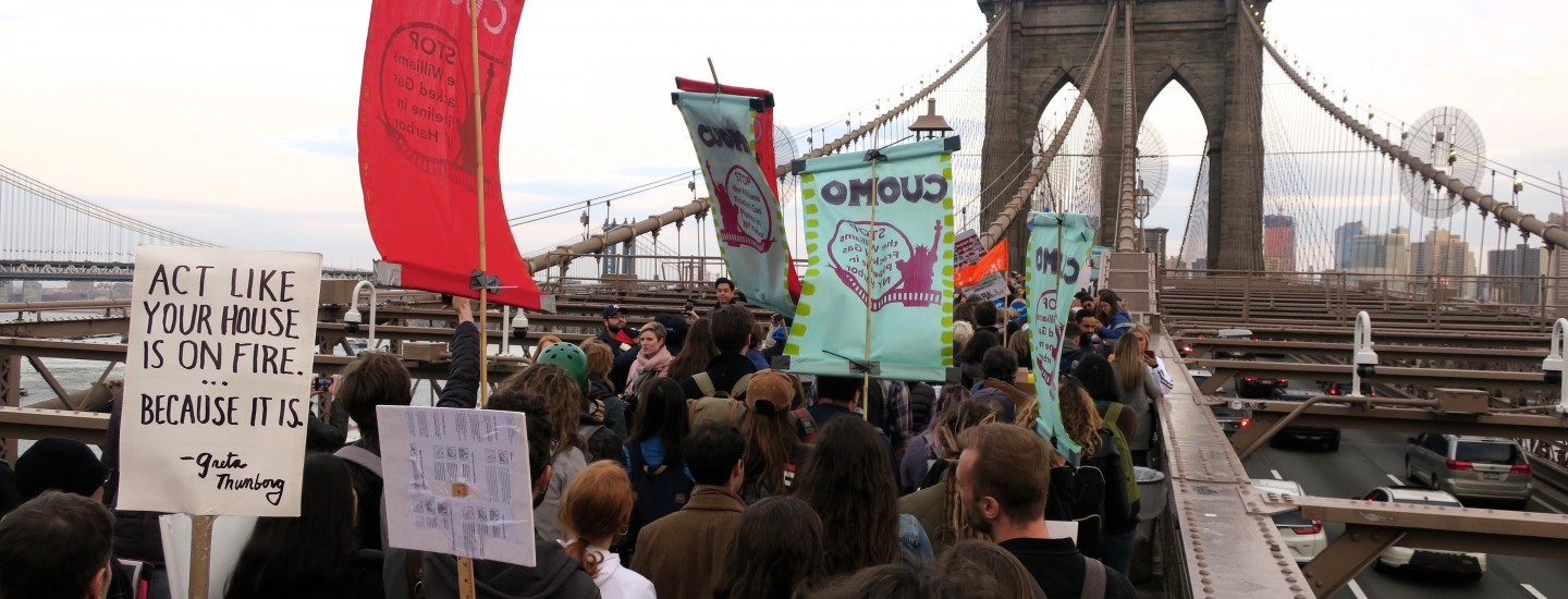 Protesters march over the Brooklyn Bridge in opposition to the Williams Pipeline