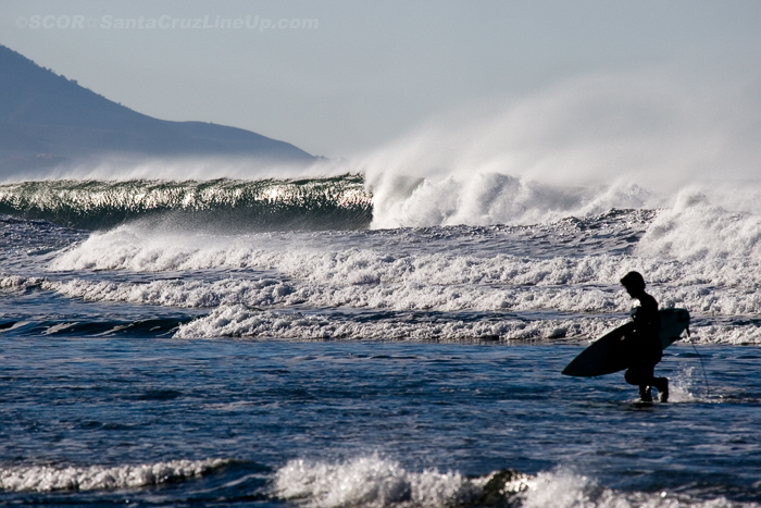 Surfer with waves in the background