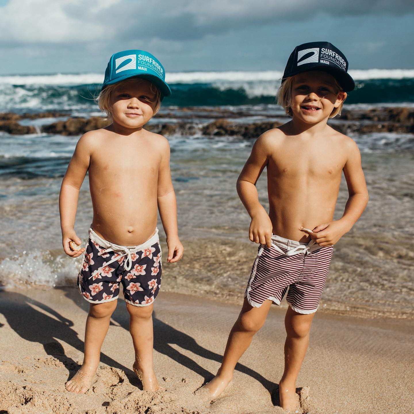 Young children helping at a Maui beach cleanup