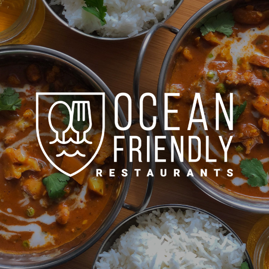Ocean Friendly Restaurants logo over top a photo of bowls of warm food