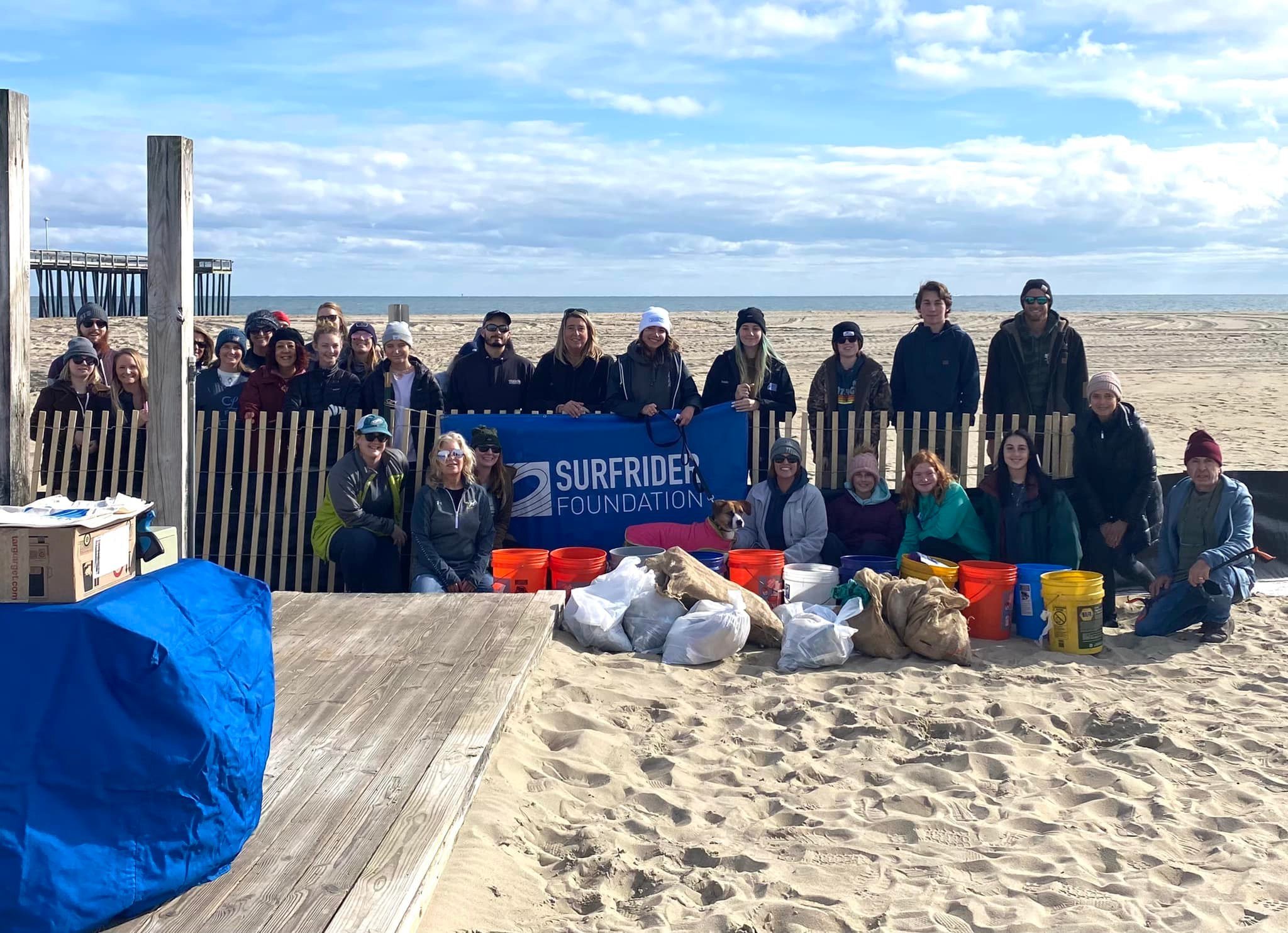 Group of volunteers at a beach cleanup at the OC inlet