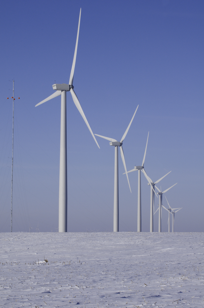 Row of wind turbines, part of windfarm in rural Illinois, in winter